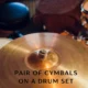 pair of cymbals on a drum set
